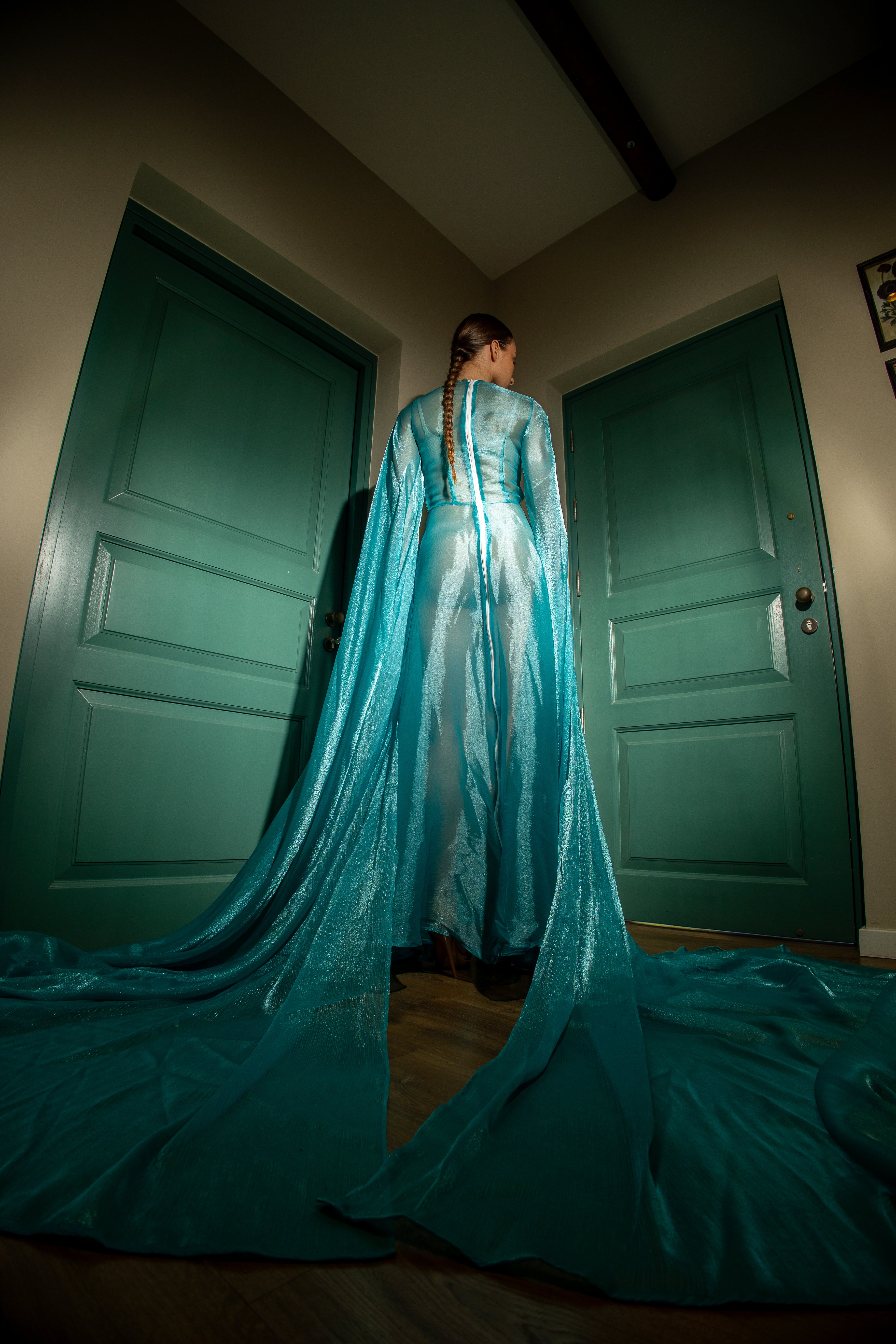 Organza silk dress with dramatic 3-meter long voluminous sleeves and a white zipper closure at the back.