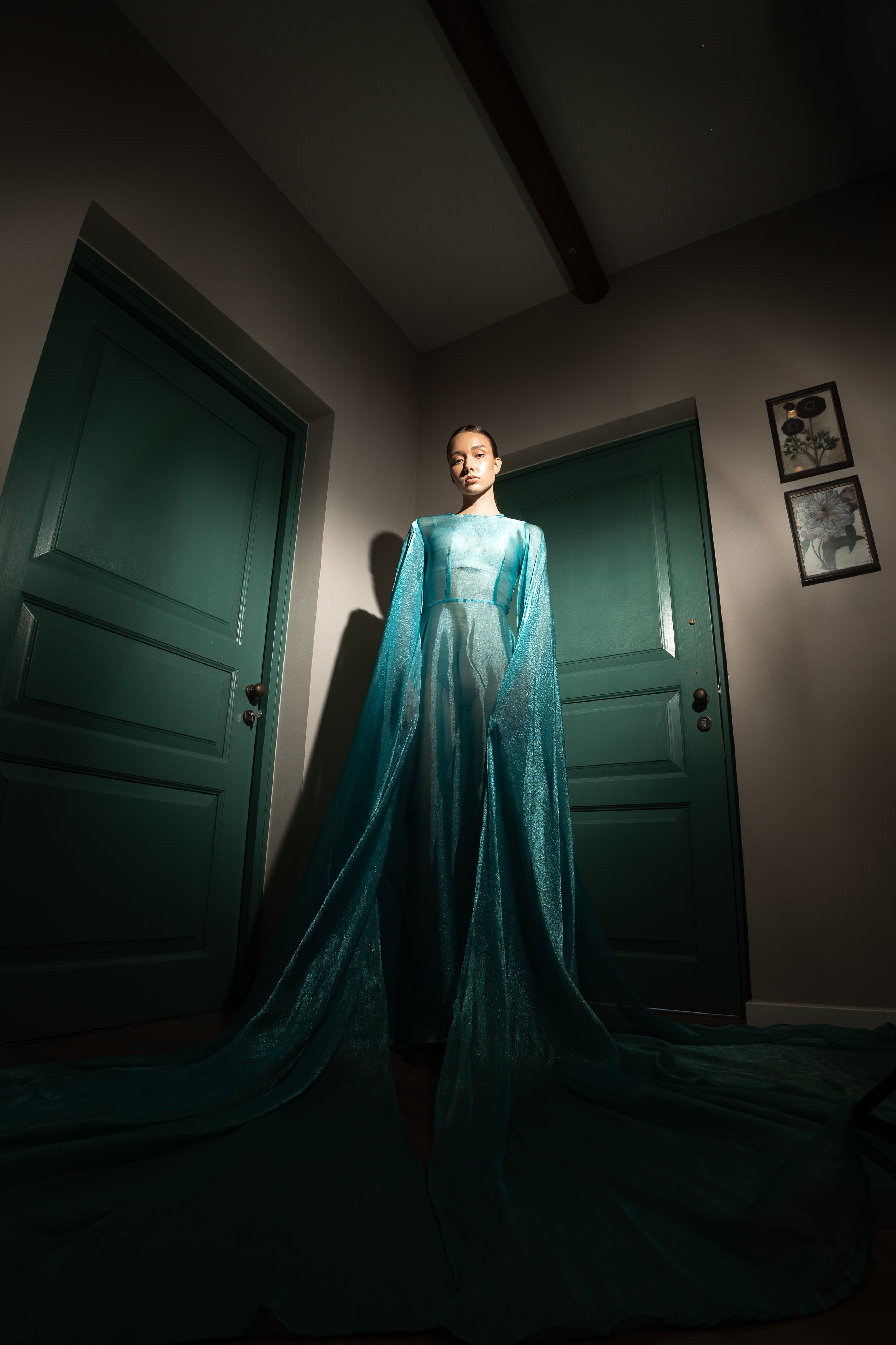 Organza silk dress with dramatic 3-meter long voluminous sleeves and a white zipper closure at the back.