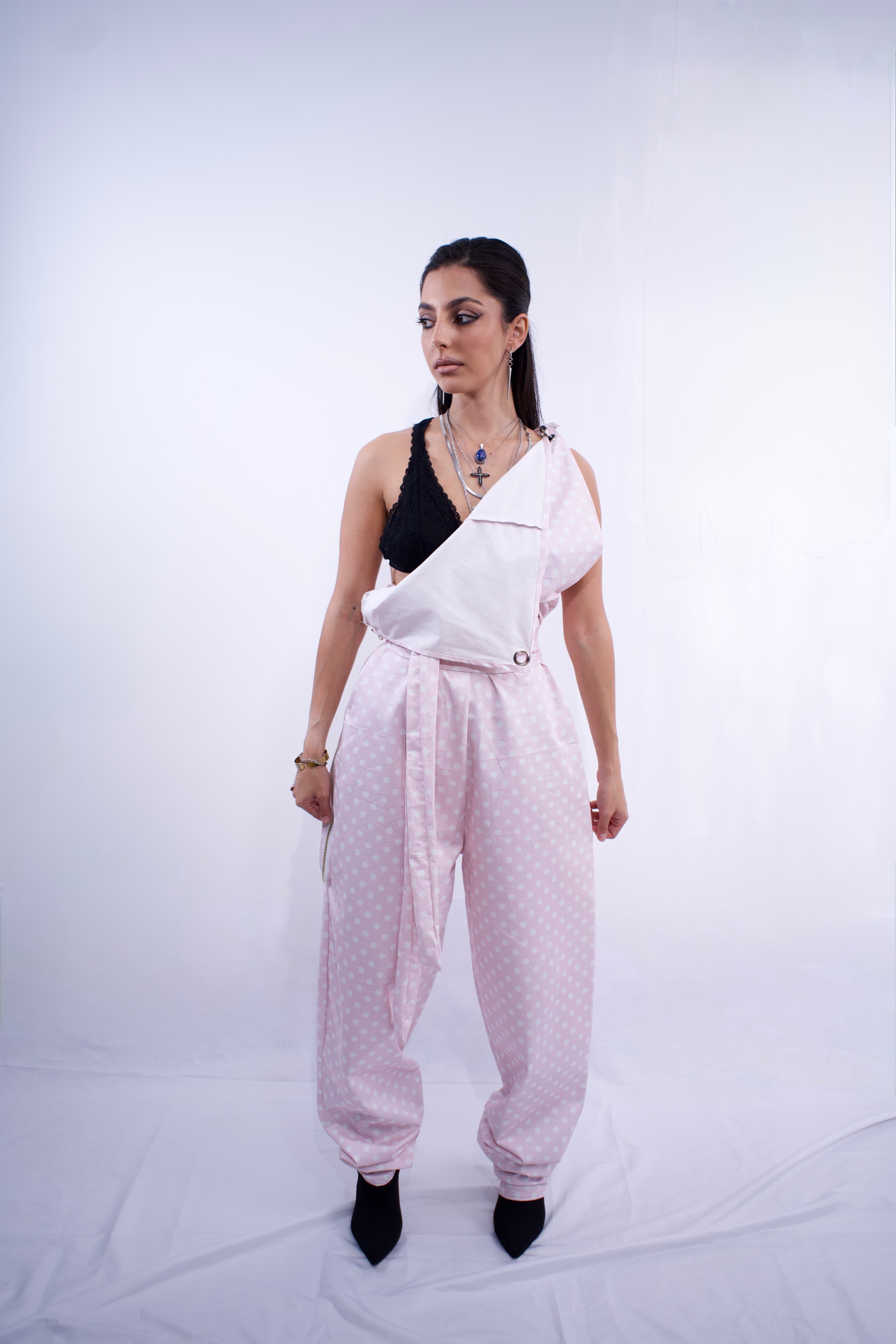 Switch Jumpsuit by MVATIS a convertible jumpsuit that transforms into sleek trousers with adjustable belt detail for cinched waist effect. 