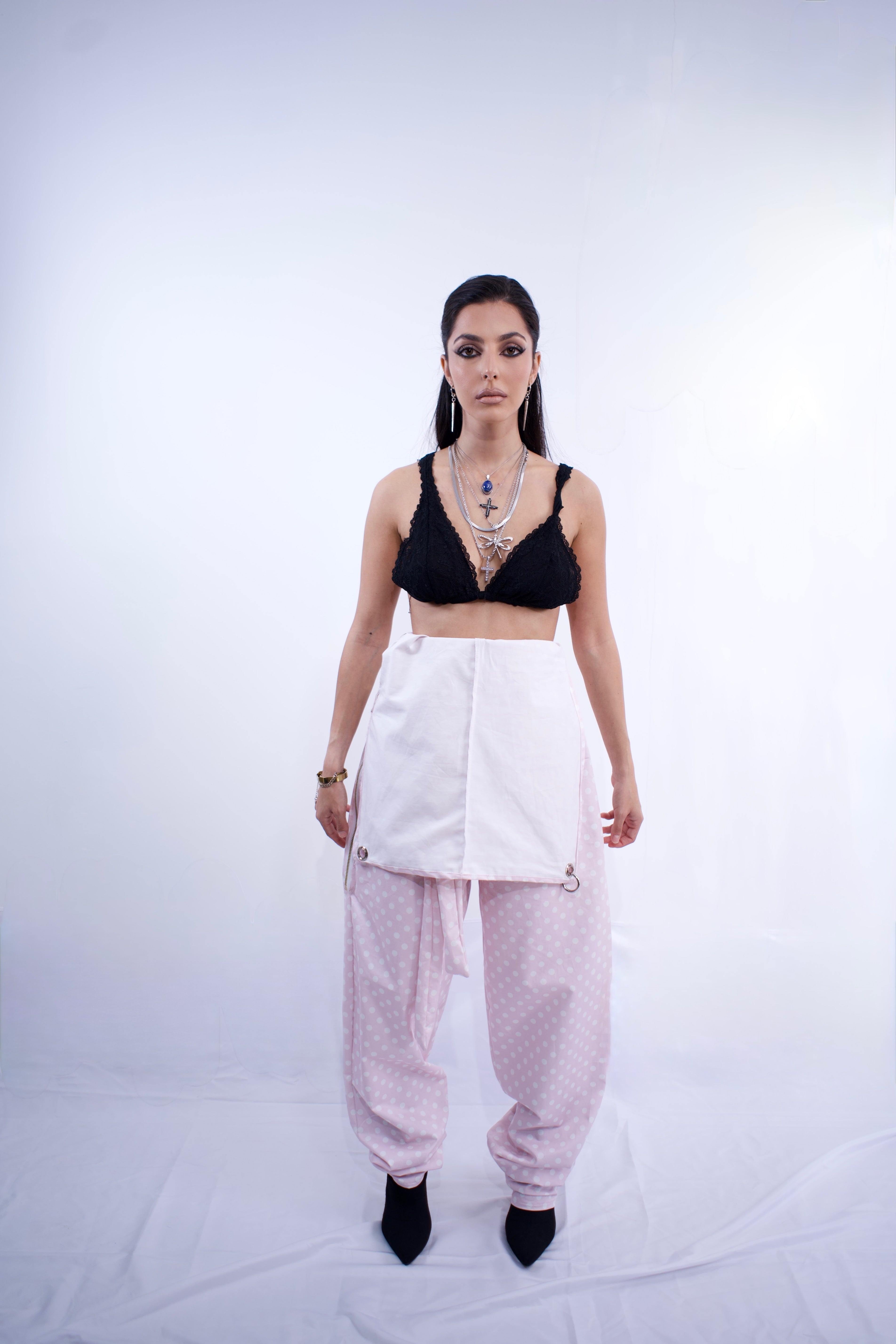 Switch Jumpsuit by MVATIS a convertible jumpsuit that transforms into sleek trousers with adjustable belt detail for cinched waist effect. 