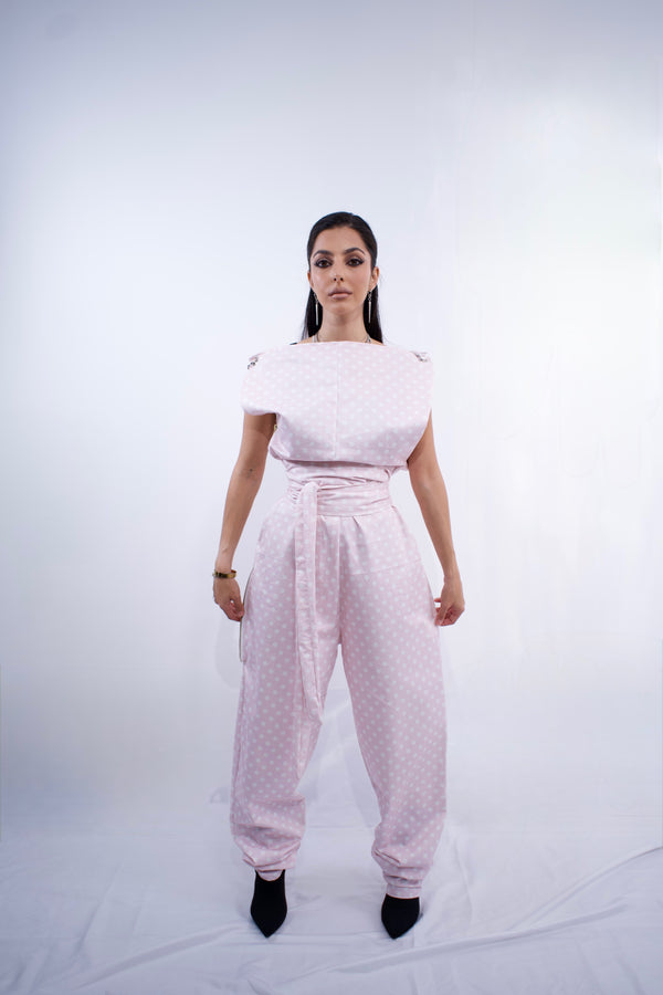 Switch Jumpsuit by MVATIS a convertible jumpsuit that transforms into sleek trousers with adjustable belt detail for cinched waist effect. 