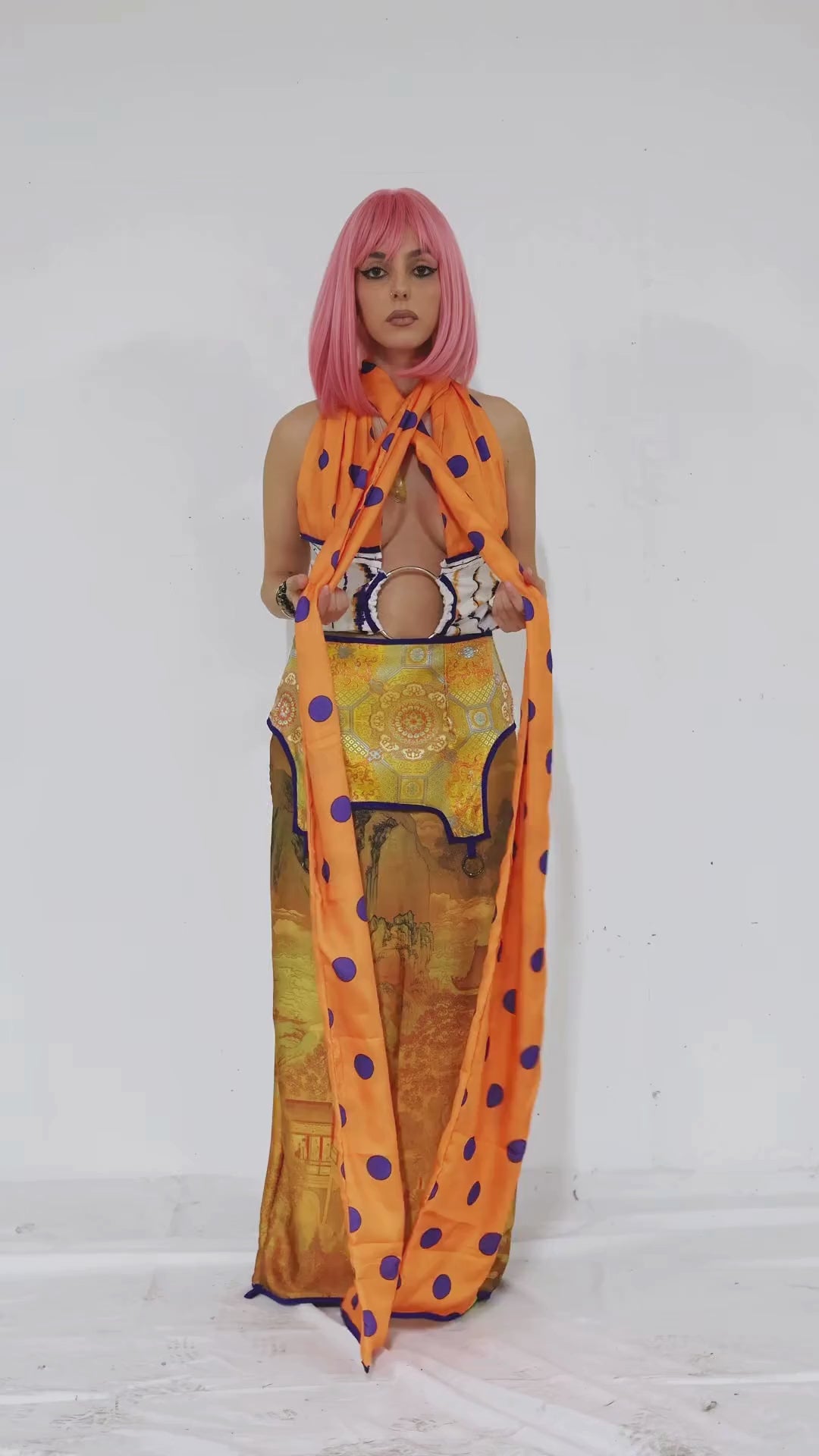 Women showing how she ties her multiwear versatile crop top 